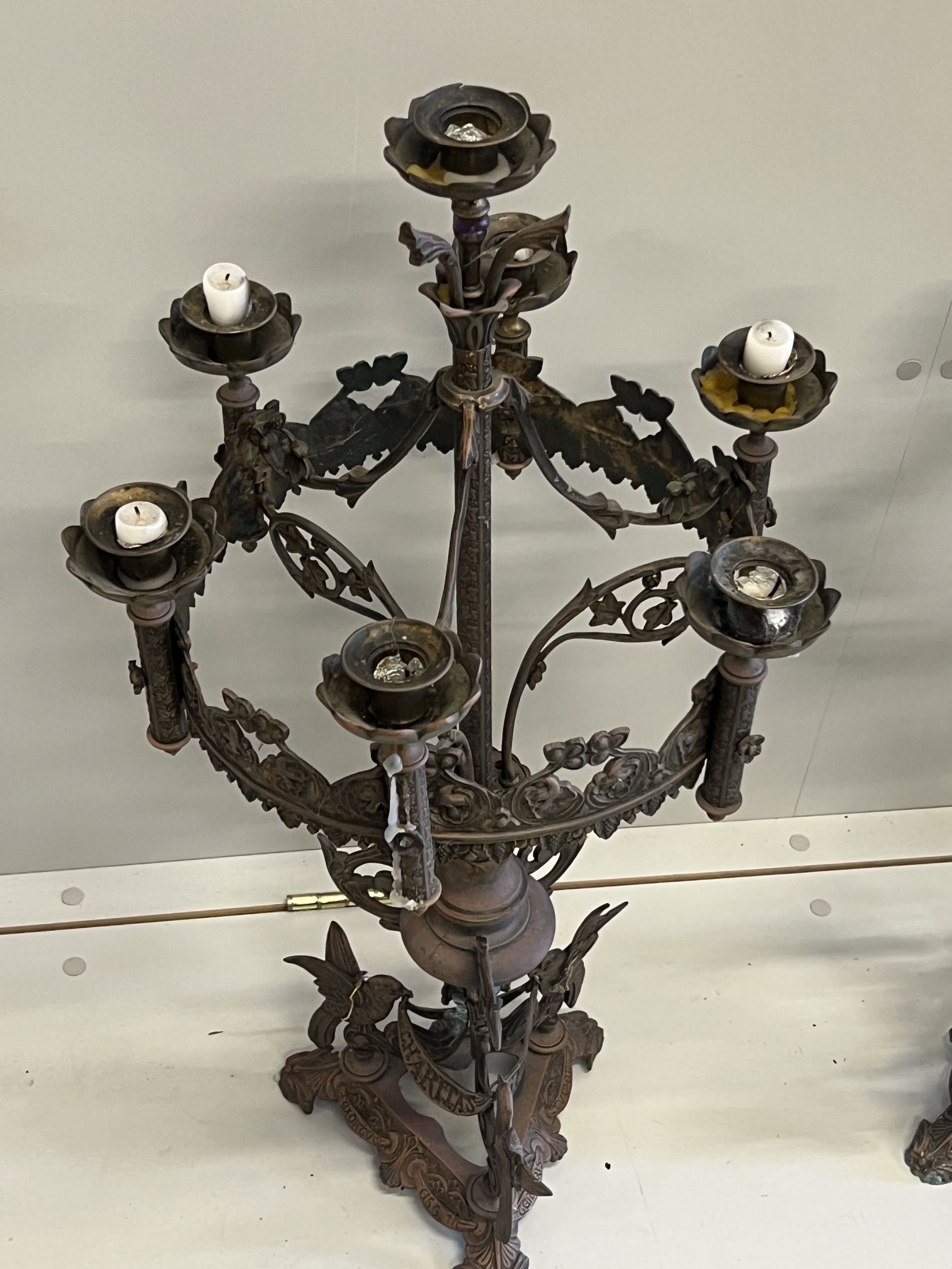 A pair of Gothic style seven branch cast metal candelabra, height 80cm